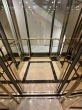 Glass Elevator Design with a Refined Finish
